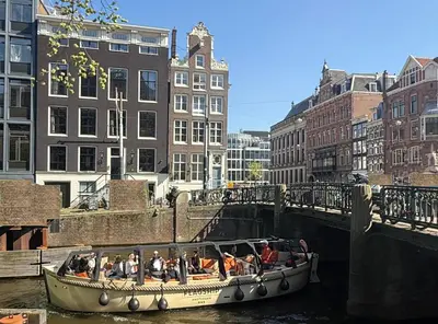 a group of people on a boat in a canal at Your a Royalty - Equal Design by JoyJoyJoy - Top Floor and Top Views - Creating houses for the poor in Amsterdam