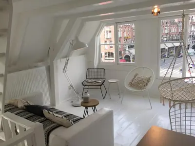 a white living room with a couch and chairs at Your a Royalty - Equal Design by JoyJoyJoy - Top Floor and Top Views - Creating houses for the poor in Amsterdam