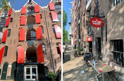 a brick building with red windows and a sign on it at Jordan Canal Studio in Amsterdam