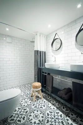 a bathroom with a toilet and two sinks and a stool at Joans B&B in Zaandam