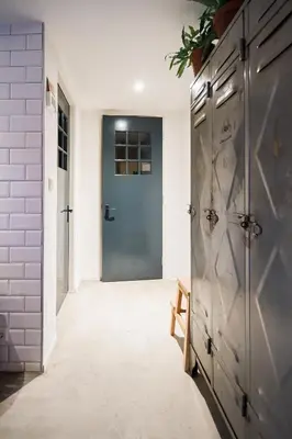 a hallway with a blue door in a house at Joans B&B in Zaandam