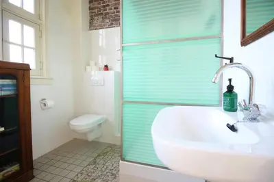 a bathroom with a sink and a toilet at Cafe Modern in Amsterdam