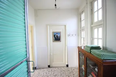a room with a door and a table with towels at Cafe Modern in Amsterdam