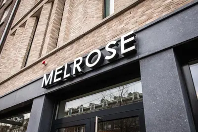 a sign on the front of a store at Melrose Hotel in Amsterdam