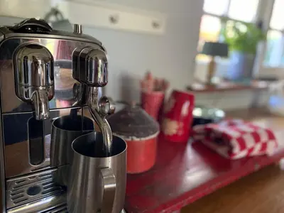 a coffee maker sitting on top of a kitchen counter at De Schuilhoek Private Guesthouse in Blaricum