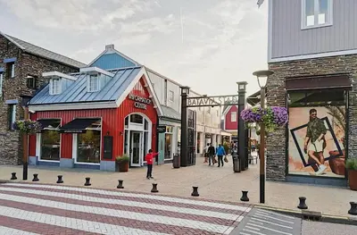a street in a town with people walking down the street at Casa Batavia B&B in Lelystad