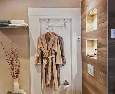 a robe hanging on a door in a room at Casa Batavia B&B in Lelystad
