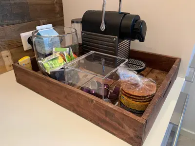 a wooden tray filled with food on a counter at Leidse Square 5 star Luxury Apartment in Amsterdam