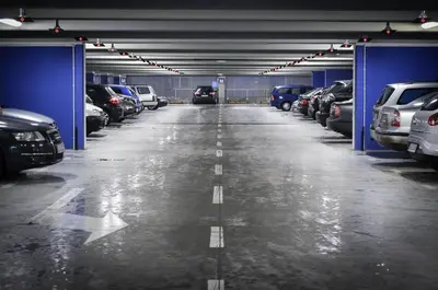 a parking garage with cars parked in it at Leidse Square 5 star Luxury Apartment in Amsterdam