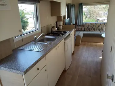 a kitchen with a sink and a counter top at CHALETS IN THE DUNES nearby the beach in IJmuiden