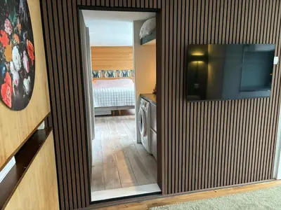 a mirror in a room with a bedroom at Houseboat Amsterdam in Amsterdam