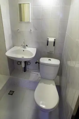 a bathroom with a toilet and a sink at Hotel Ben Centre in Amsterdam