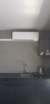 a kitchen with a sink and a white ceiling at Boutique Suites Lisse - Keukenhof in Lisse