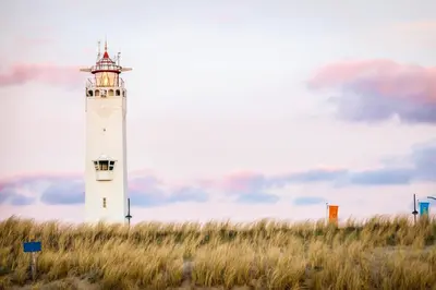 a lighthouse sitting on top of a grass field at Boutique Suites Lisse - Keukenhof in Lisse