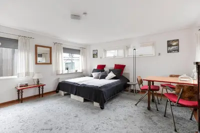 a bedroom with a bed and a table in it at Authentic Dutch Houseboat in Amsterdam Zuid in Amsterdam