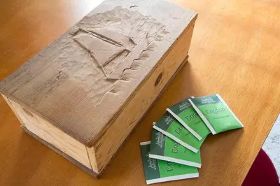 a wooden box sitting on top of a table at Authentic Dutch Houseboat in Amsterdam Zuid in Amsterdam