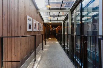 a hallway in a building with a glass ceiling at Hotel van de Vijsel in Amsterdam