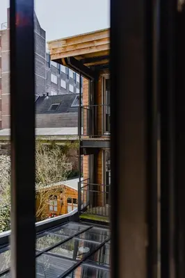 a view of a building from a window at Hotel van de Vijsel in Amsterdam