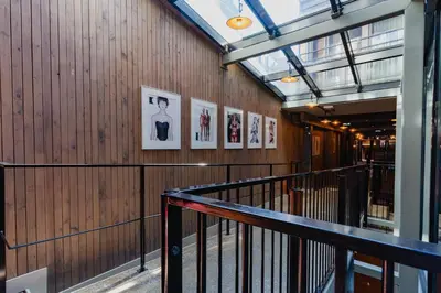 a hallway with pictures on the walls of a building at Hotel van de Vijsel in Amsterdam