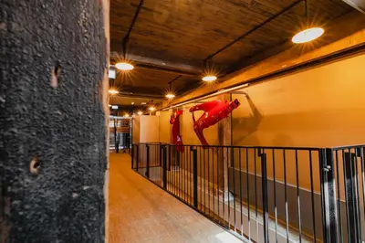 a hallway in a building with a red horse on the wall at Hotel van de Vijsel in Amsterdam