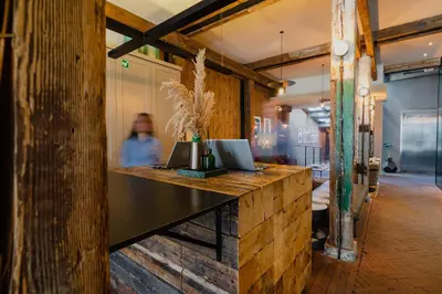 a counter with two laptops on top of it at Hotel van de Vijsel in Amsterdam