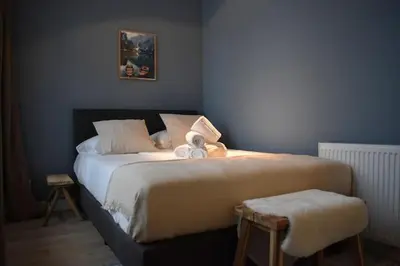 a bedroom with a bed with two towels on it at Rembrandtplein Apartments in Amsterdam