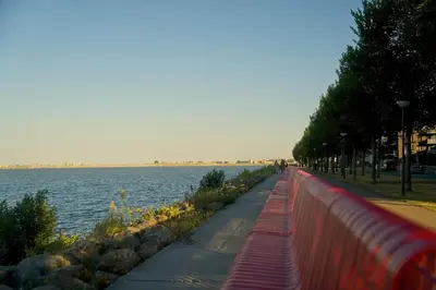 a sidewalk next to a body of water at The Water Studio in Amsterdam
