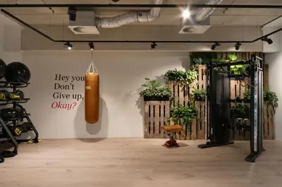 a room with plants and a sign on the wall at Residence Inn by Marriott Amsterdam Houthavens in Amsterdam