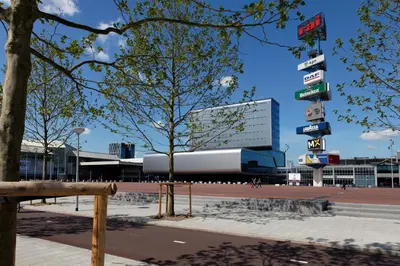 a building with many signs in front of it at Beautiful penthouse near Rai and centre in Amsterdam