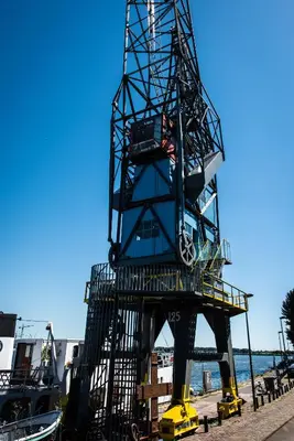 a large metal structure on the beach at Numa Amsterdam The Crane in Amsterdam