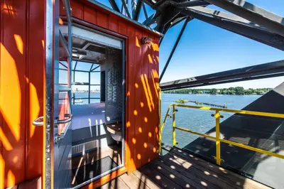 a view from the side of a boat on the water at Numa Amsterdam The Crane in Amsterdam