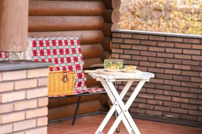 a white table with glasses on it on a patio at Wijngaard Saalhof in Wognum