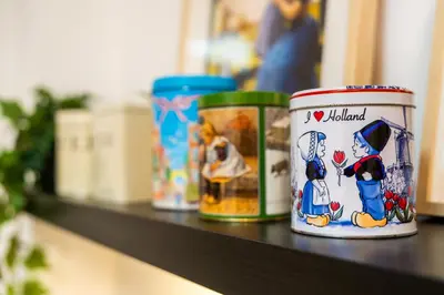 three canisters sitting on a shelf at Stylish Private Studio Close to City in Amsterdam