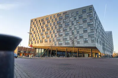 a large building with a canopy in front of it at Stylish Private Studio Close to City in Amsterdam
