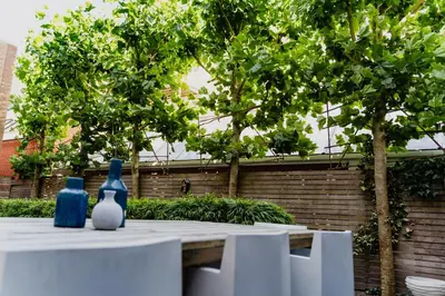 two blue and white vases sitting on top of a table at Hotel JL No76 in Amsterdam