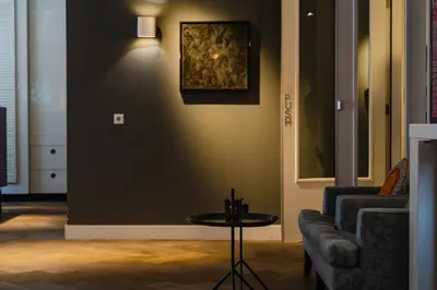 a living room with a couch and a table at Hotel JL No76 in Amsterdam