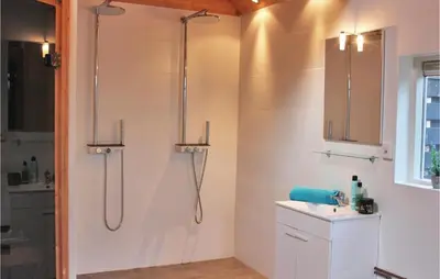 a bathroom with a shower and a sink at Penhuis in Winkel