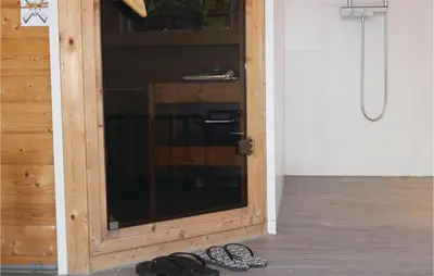 a pair of shoes sitting next to a door at Penhuis in Winkel