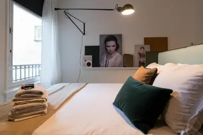 a bedroom with a bed with a large mirror at Canal Suite City Centre in Amsterdam