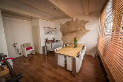 a room with a table in a room with a wall at City Break Amsterdam in Amsterdam