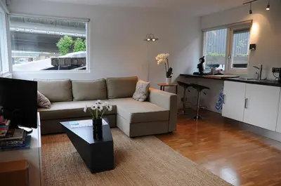 a living room with a couch and a table at Boathotel in Amsterdam