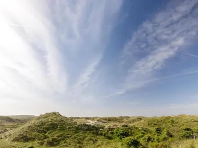 a view of a mountain with a blue sky at Apartment in Bergen aan Zee near the Beach in Bergen aan Zee