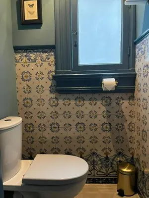 a bathroom with a white toilet and a window at SeventyFive in Amsterdam