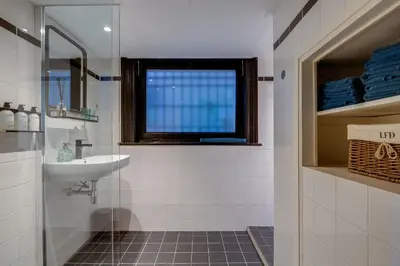 a bathroom with a sink and a window at SeventyFive in Amsterdam
