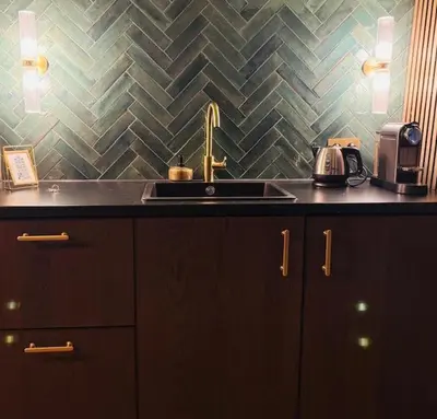 a kitchen with a sink and a counter top at SeventyFive in Amsterdam