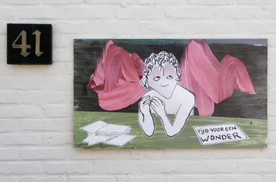 a painting of a woman hanging on a wall at holiday cottage 'FLOW' in Bergen