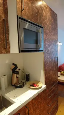 a microwave sitting on top of a kitchen counter at Huis Roomolen in Amsterdam