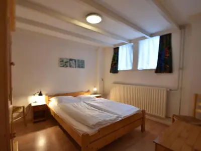 a bedroom with a bed and a window at Holiday Home in Bergen near North Sea Beach in Bergen aan Zee