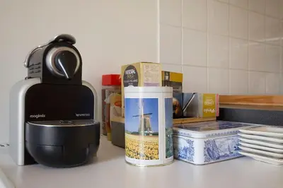a kitchen counter with a mixer and other kitchen items at Johan's B&B - Since 2014 roofterrace and cheap parking in Amsterdam