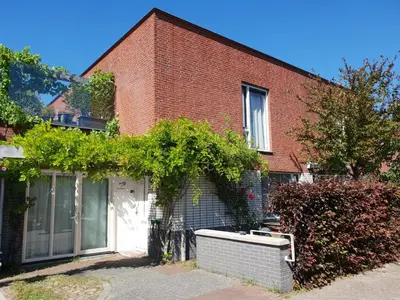 a brick building with a bath tub in front of it at Johan's B&B - Since 2014 roofterrace and cheap parking in Amsterdam